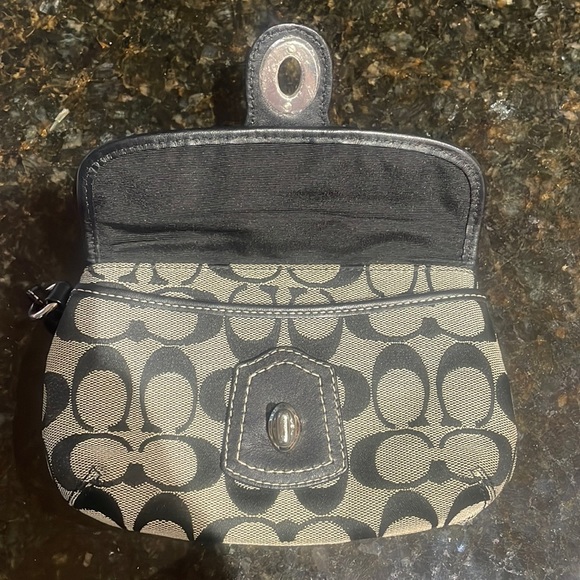 Coach Wristlet approximately 7.5 inches long by 5 inches wide. Good condition. - Picture 3 of 6